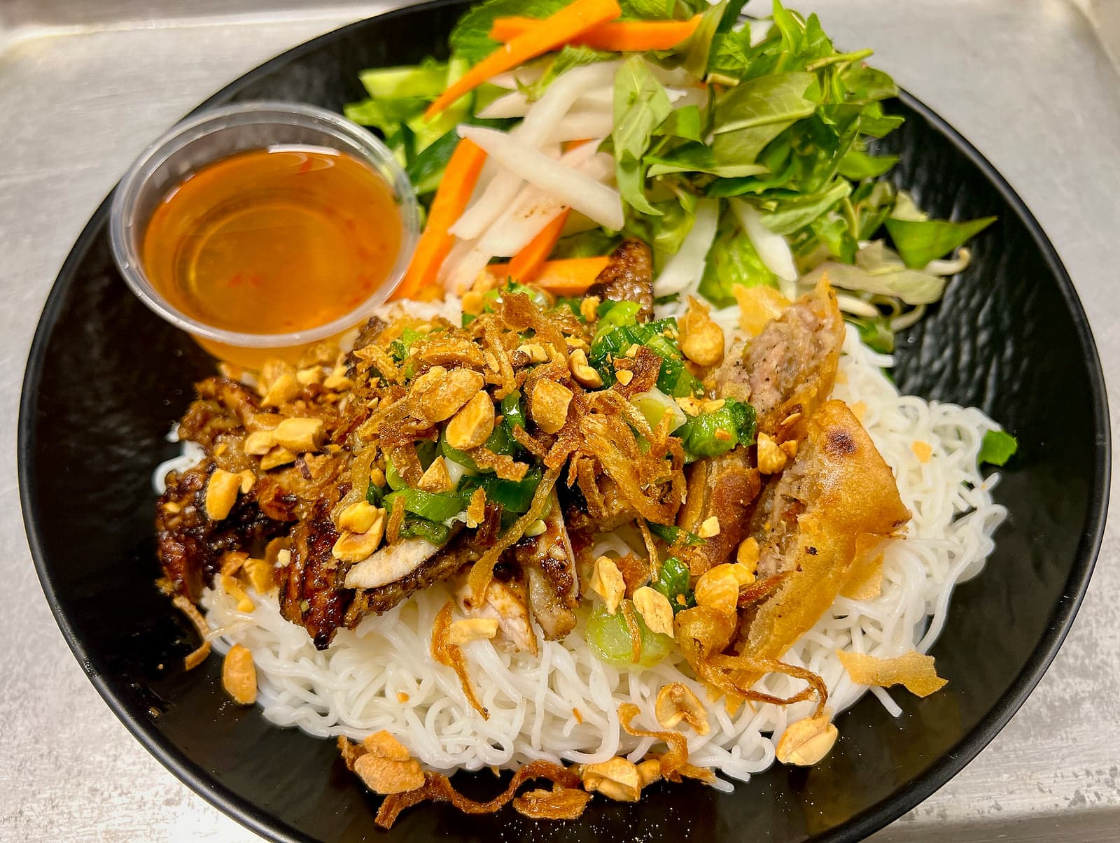 Vermicelli Noodles with grilled chicken and deep fried egg roll