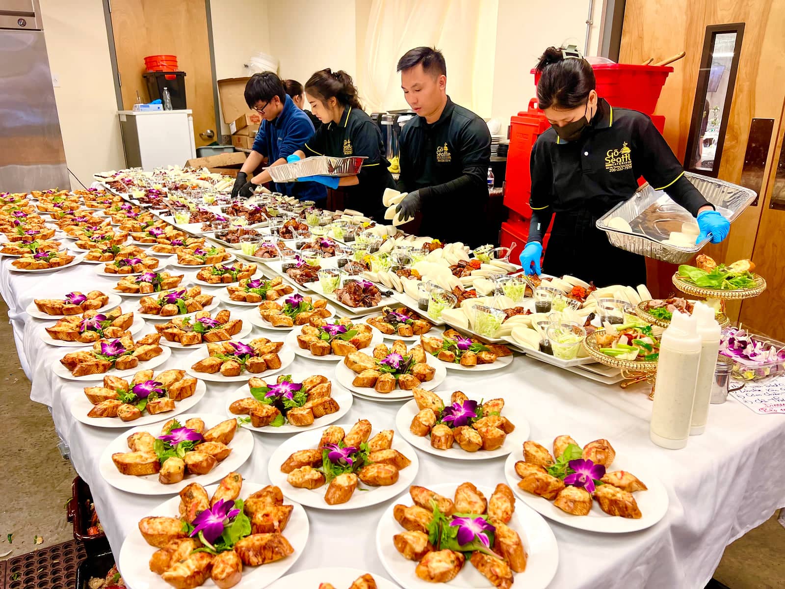Gõ Seattle Catering preparing a Vietnamese celebration buffet